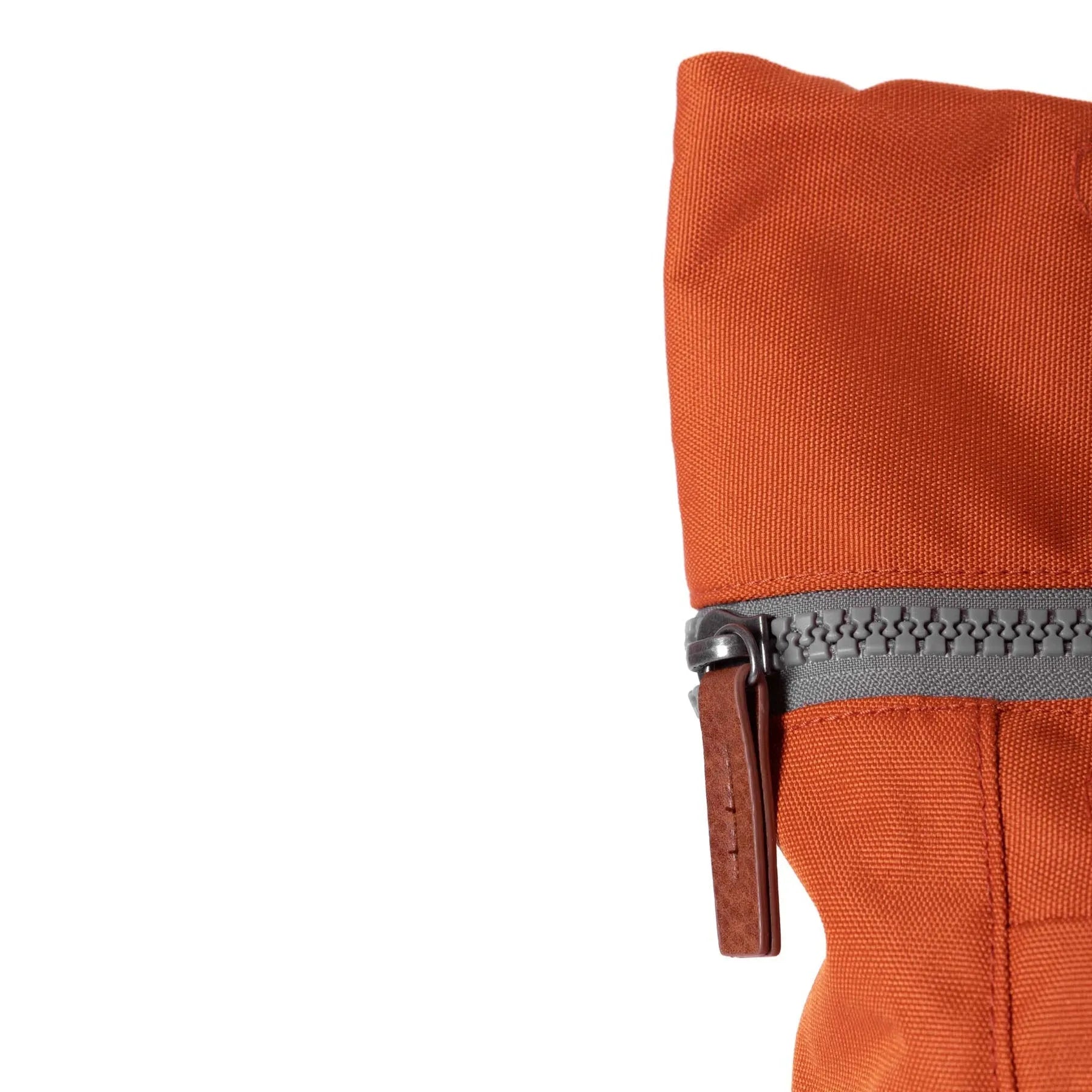 Roka Finchley A Atomic Orange Recycled Canvas backpack featuring durable fabric and grey zipper with leather pull tab.