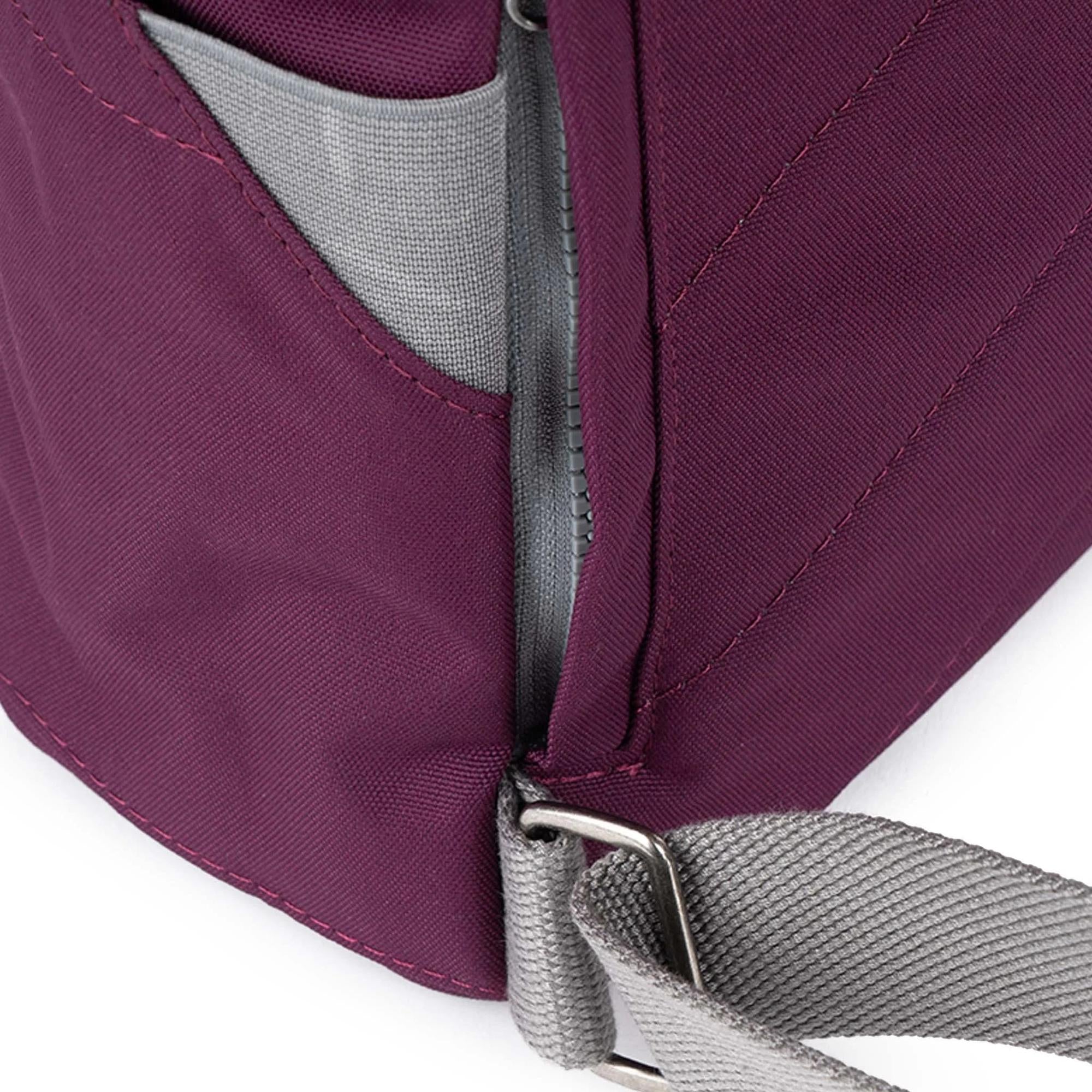 Roka Finchley Cherry Lacquer recycled canvas tote bag with gray adjustable strap and zip closure, in cherry red color.