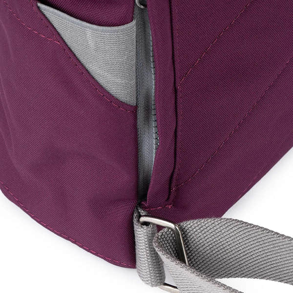 Roka Finchley Cherry Lacquer recycled canvas tote bag with gray adjustable strap and zip closure, in cherry red color.