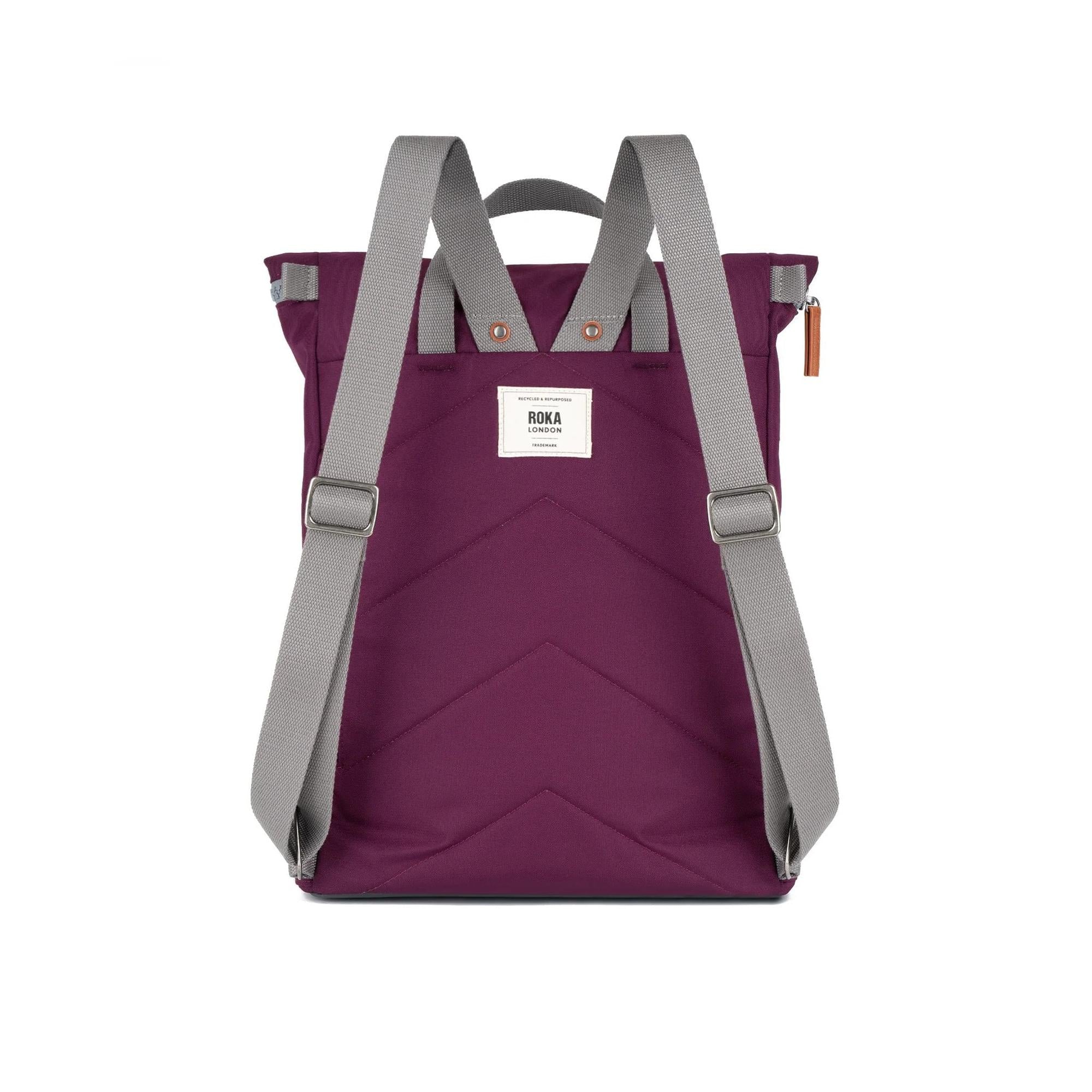 Roka Finchley A Cherry Lacquer Recycled Canvas backpack with grey adjustable straps and front pocket.
