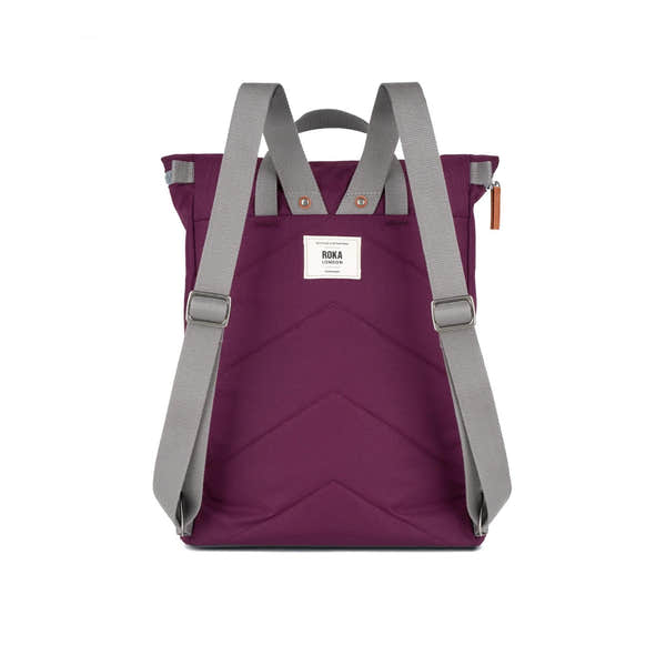 Roka Finchley A Cherry Lacquer Recycled Canvas backpack with grey adjustable straps and front pocket.