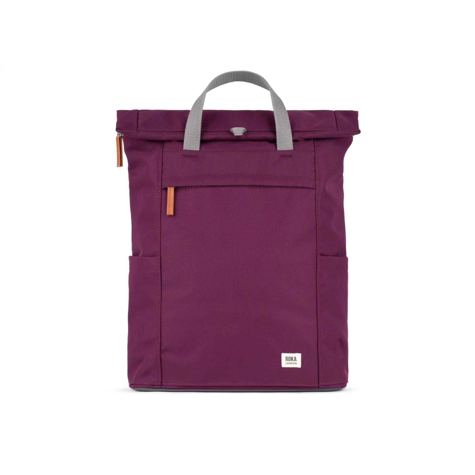Roka Finchley A Cherry Lacquer Recycled Canvas backpack in cherry color with gray handle and leather accents.