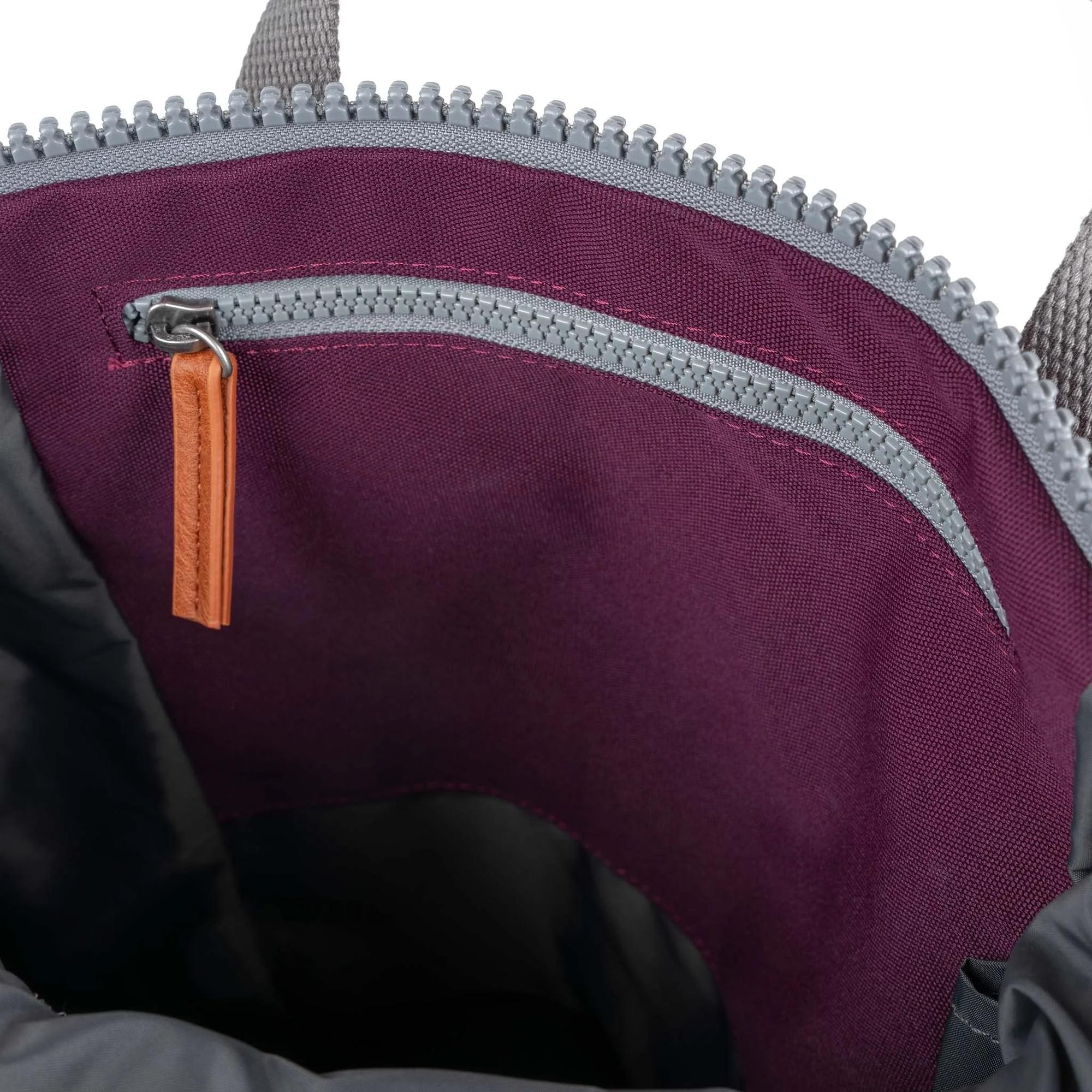 Roka Finchley A Cherry Lacquer Recycled Canvas interior with zip pocket and purple fabric lining.