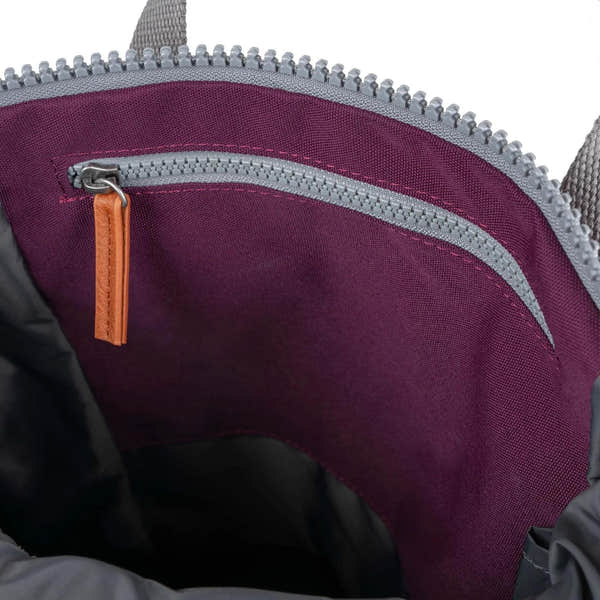 Roka Finchley A Cherry Lacquer Recycled Canvas interior with zip pocket and purple fabric lining.