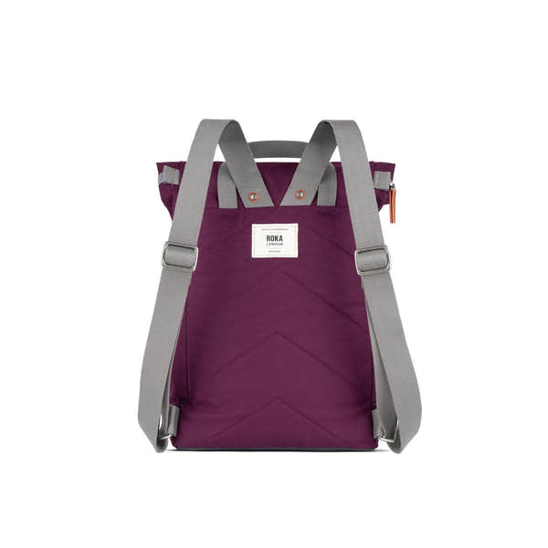 Roka Finchley backpack with cherry red lacquer recycled canvas, gray straps, and front label, stylish eco-friendly design.