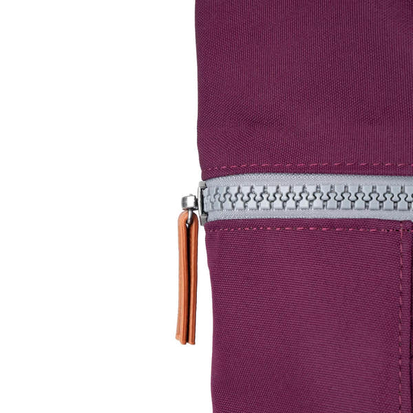 Roka Finchley cherry lacquered recycled canvas bag with silver zipper and tan leather pull tab.