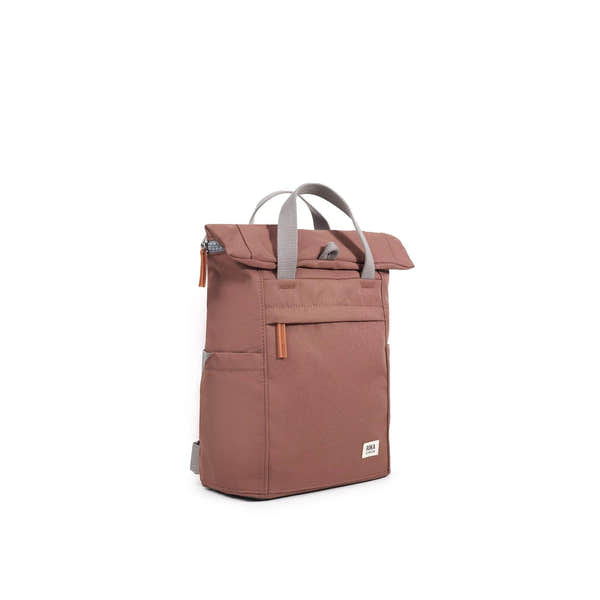 Roka Finchley A Coco recycled canvas backpack in muted pink with grey handles and orange zipper pull, stylish eco-friendly bag.