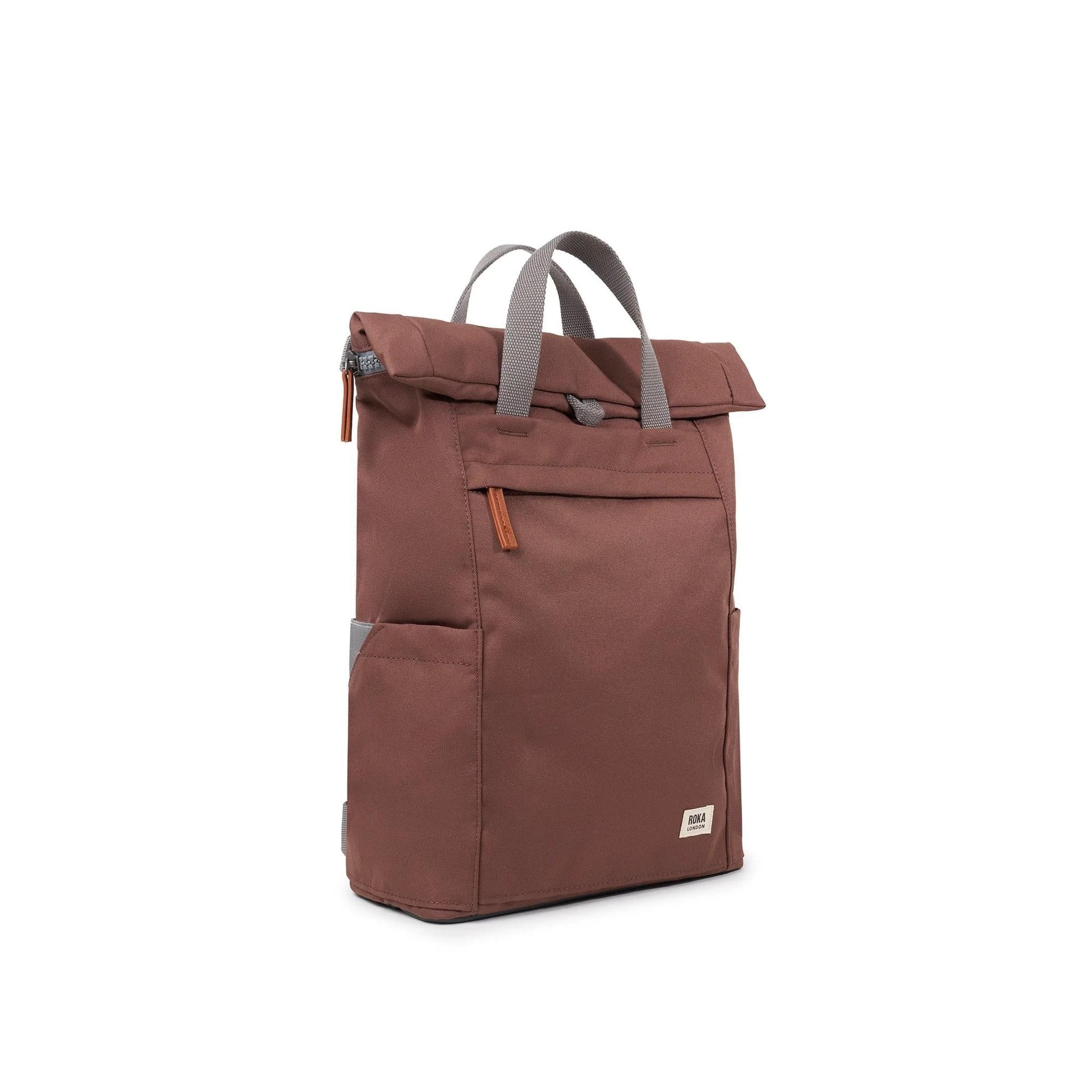 Roka Finchley A Coco recycled canvas backpack with front zip pocket and gray handles on a white background.