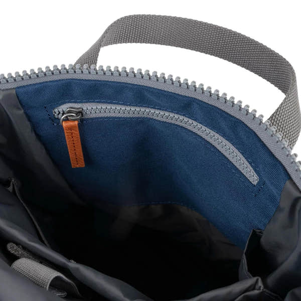 Roka Finchley blue recycled canvas bag interior with zip pocket, durable handle and spacious design.
