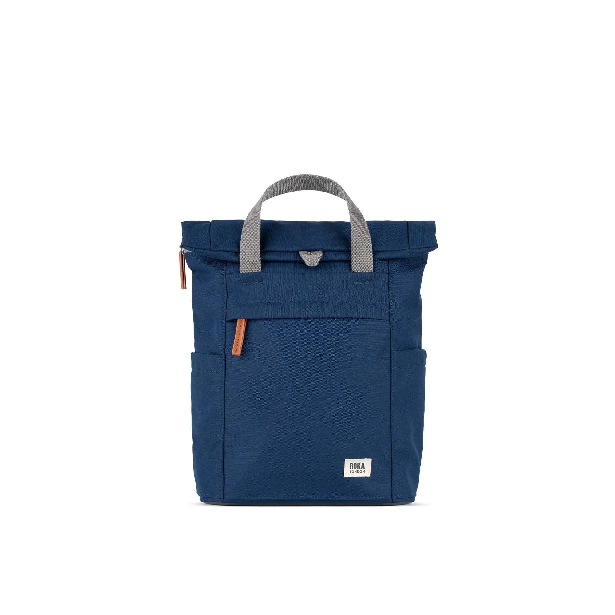 Roka Finchley backpack in crisp blue recycled canvas with grey handles and leather accents.
