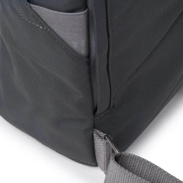 Roka Finchley A Faded Black Recycled Canvas backpack with adjustable strap and front pocket detail.