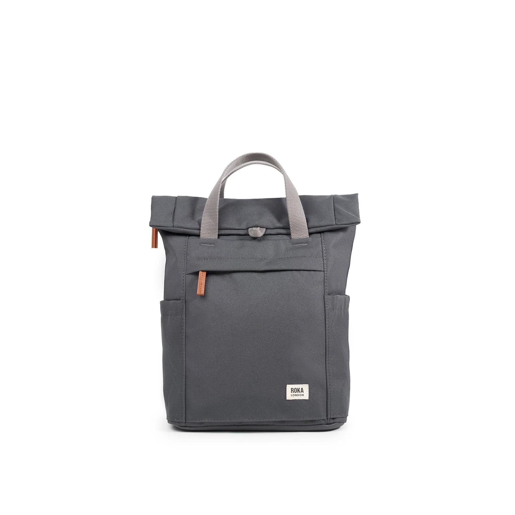 Roka Finchley A Faded Black Recycled Canvas backpack with beige handles and front pocket.