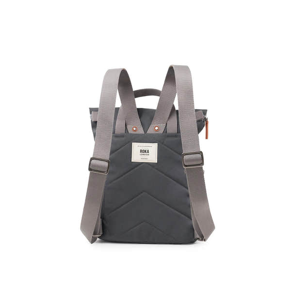 Roka Finchley backpack in faded black recycled canvas with adjustable straps and front patch label.