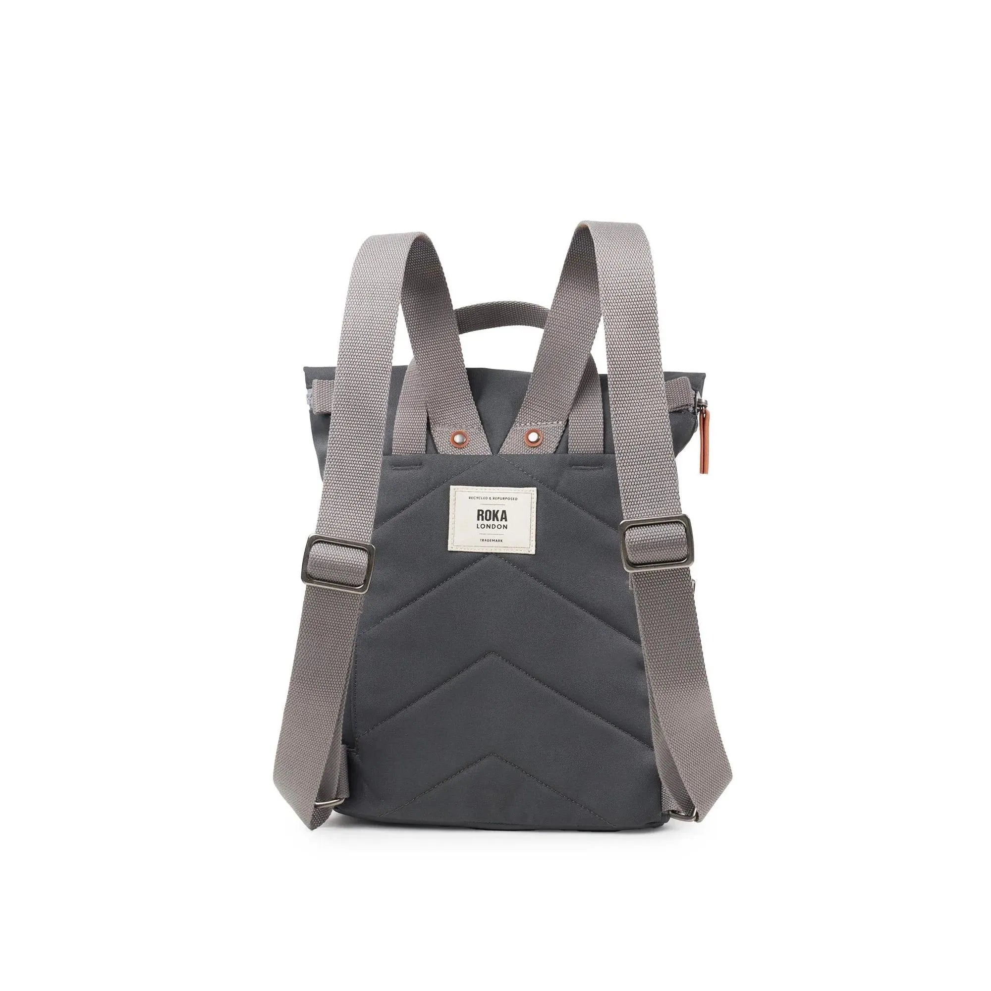 Roka Finchley backpack in faded black recycled canvas with adjustable straps and front patch label.