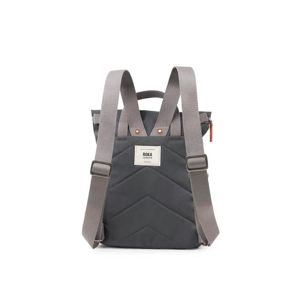 Roka Finchley backpack in faded black recycled canvas with adjustable straps and front patch label.