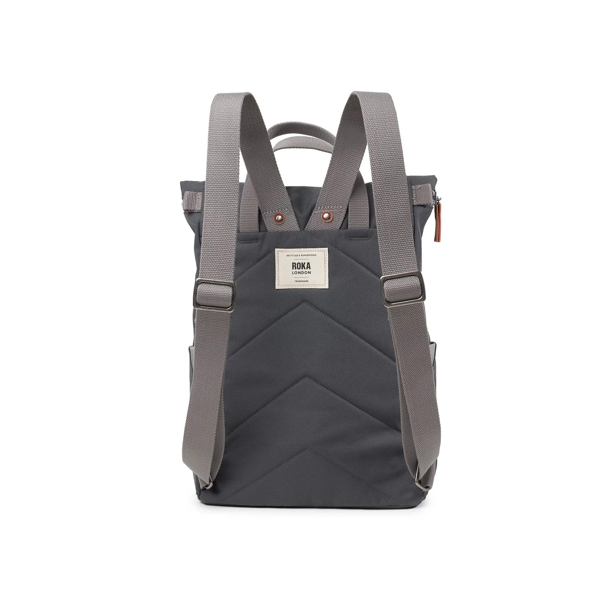 Roka Finchley backpack in faded black recycled canvas with adjustable straps and front label detail.