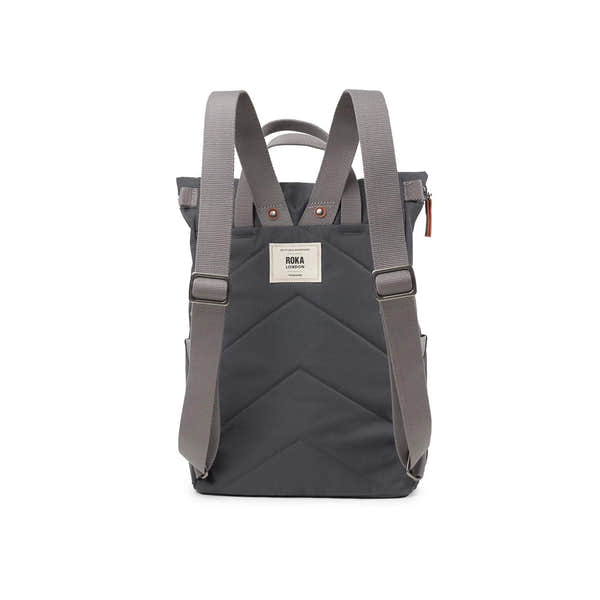 Roka Finchley backpack in faded black recycled canvas with adjustable straps and front label detail.