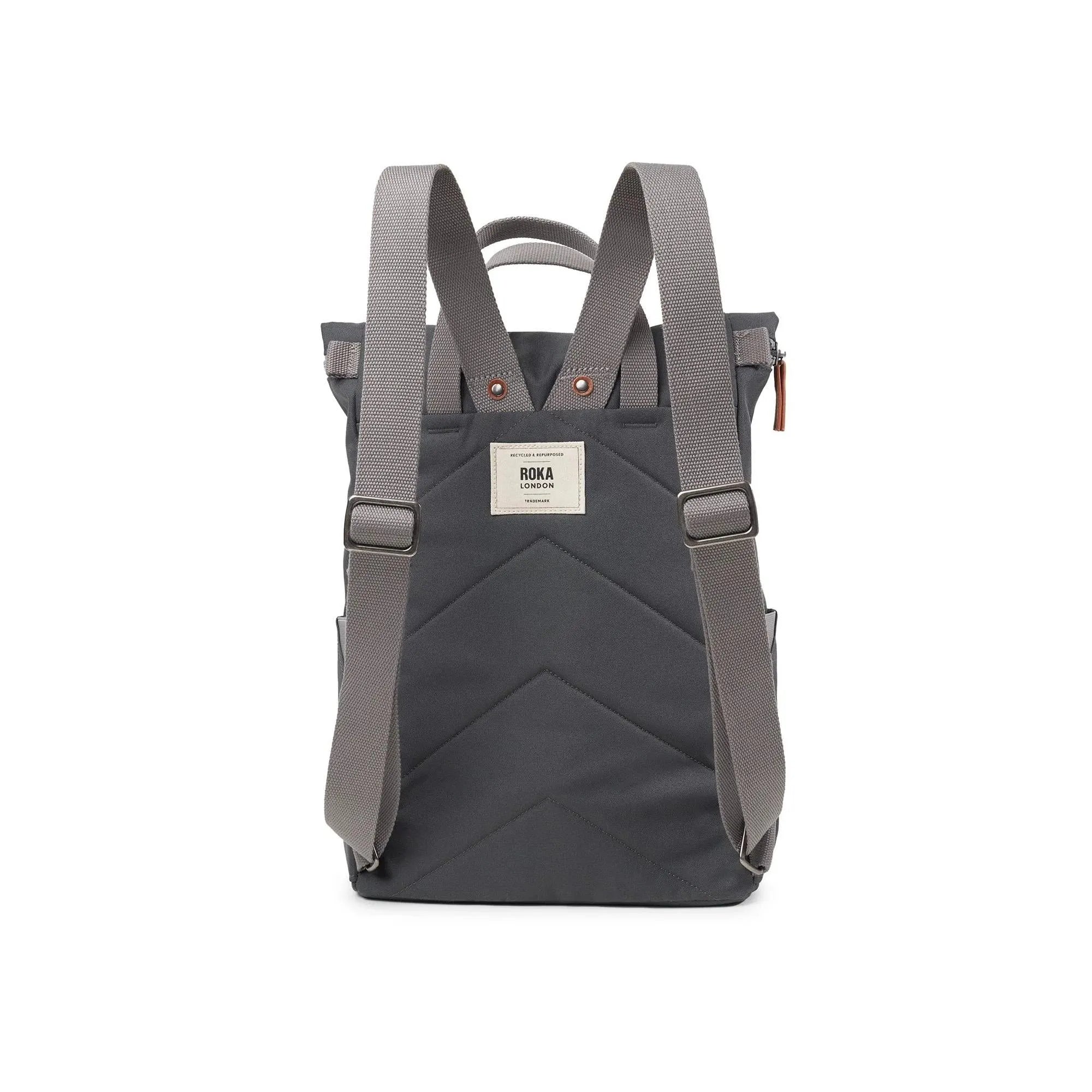 Roka Finchley backpack in faded black recycled canvas with adjustable straps and front label detail.