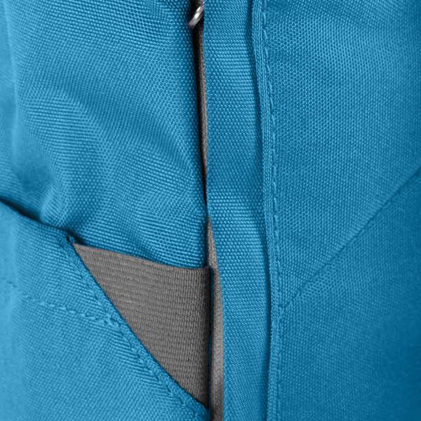Close-up of a blue Roka Finchley A Marine recycled canvas backpack with gray accents and a zipper detail.