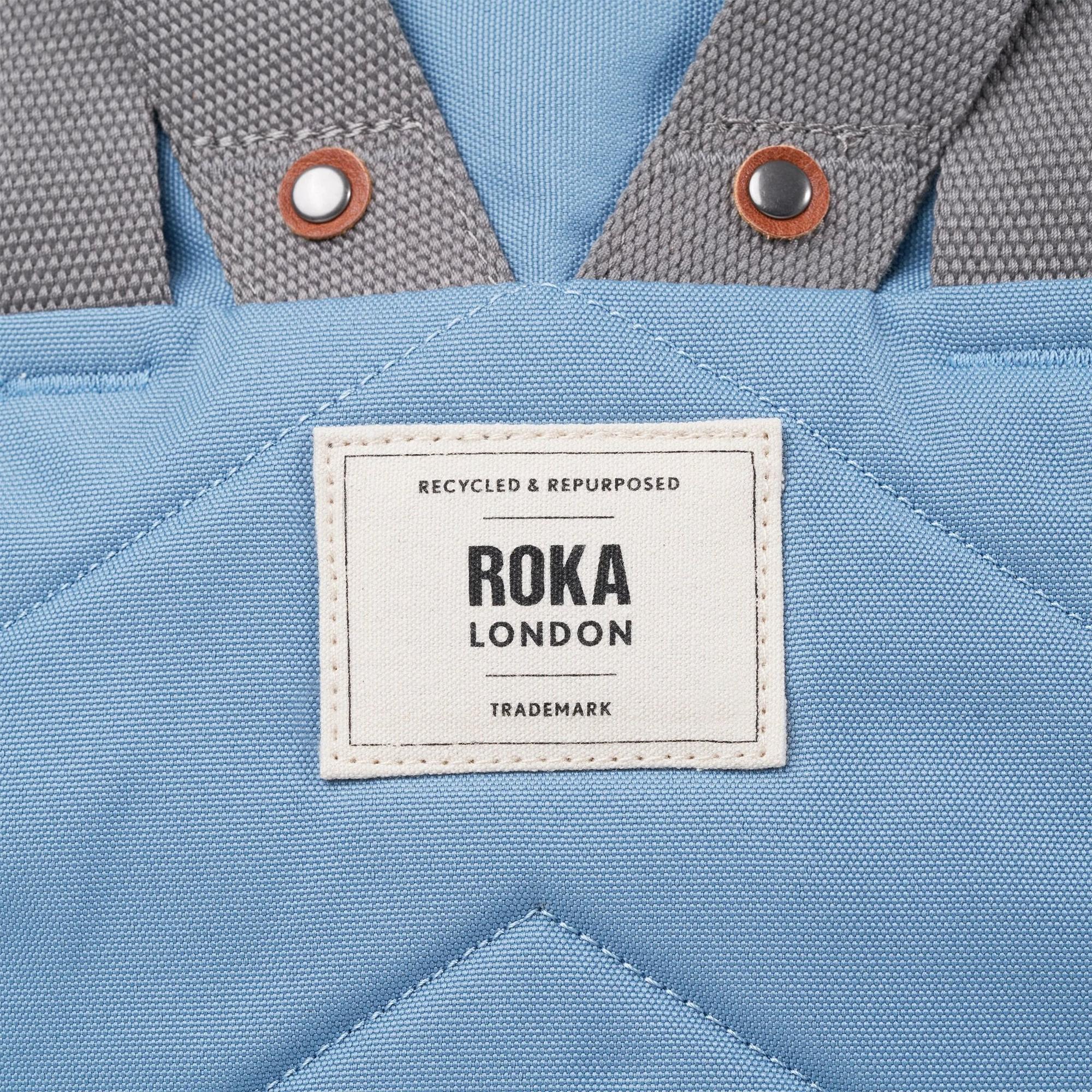 Roka Finchley blue recycled canvas tote bag with grey straps and leather detail, eco-friendly, stylish accessory.