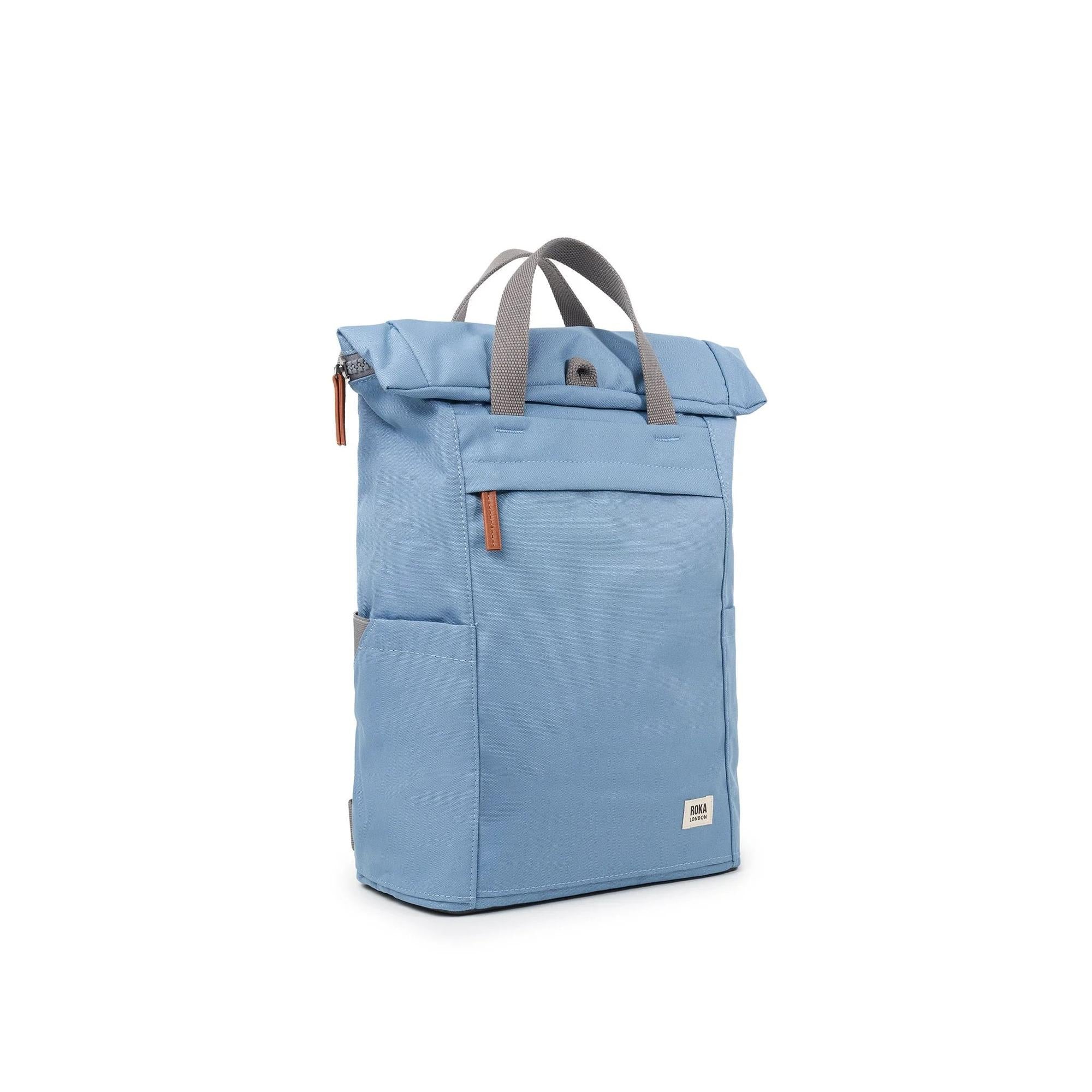 Roka Finchley A Retro Blue Recycled Canvas backpack with gray handles and leather accents, stylish and eco-friendly.