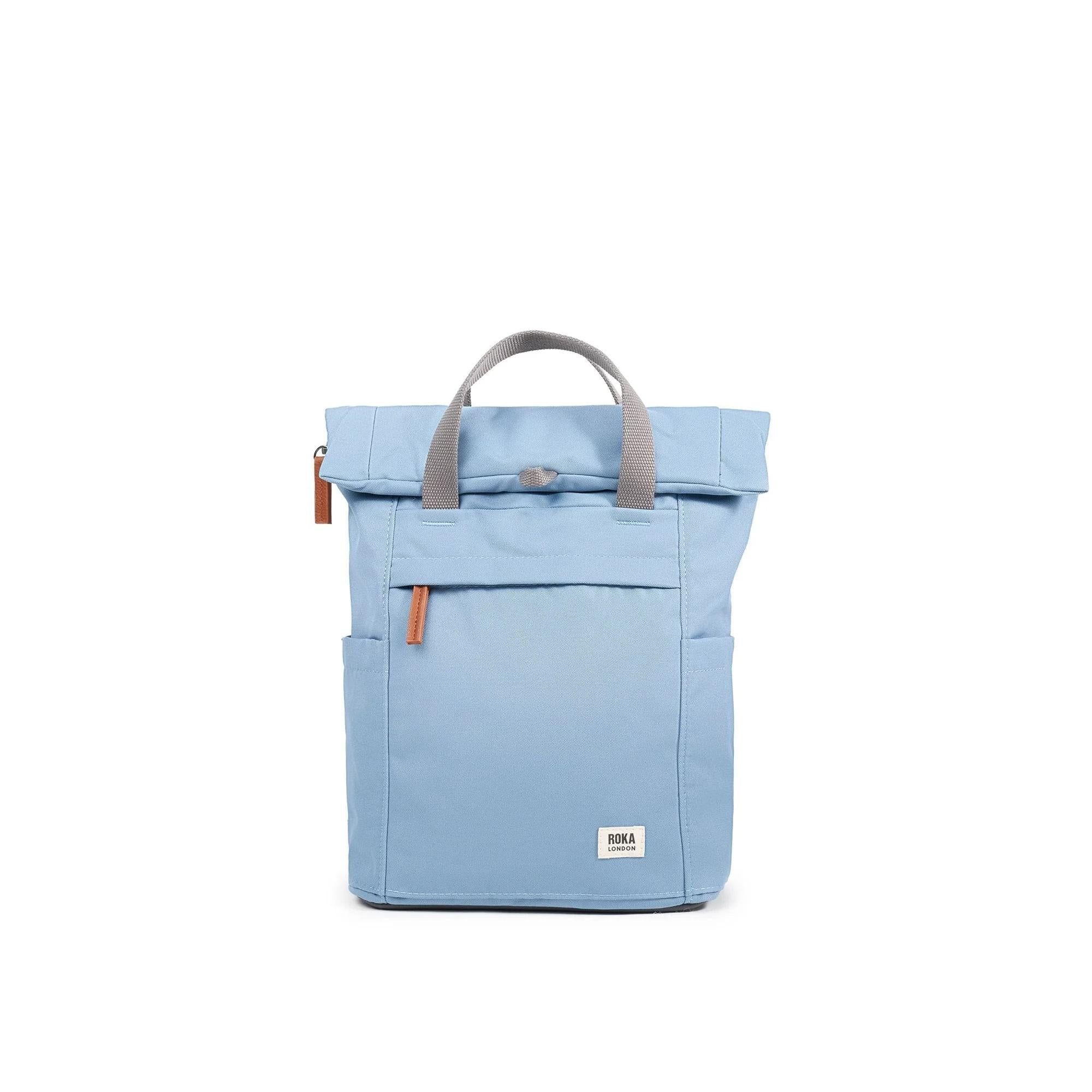 Roka Finchley A Retro Blue Recycled Canvas Backpack with grey handles and front pocket.