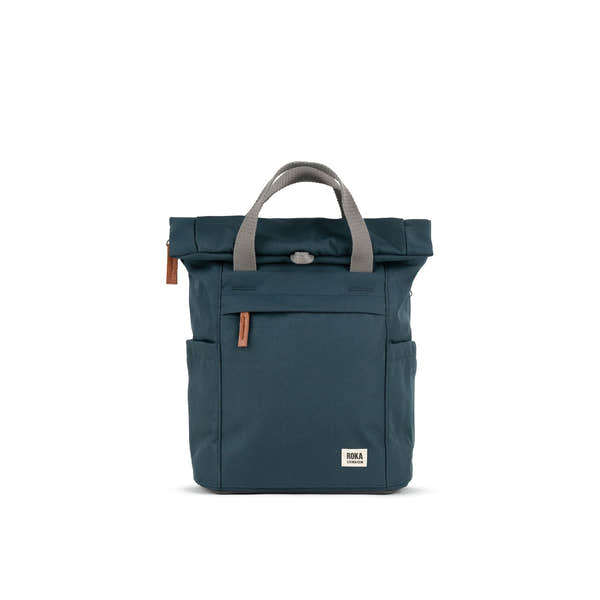Roka Finchley A Smoke recycled canvas backpack with gray handles, front zipper pocket, and leather accents.
