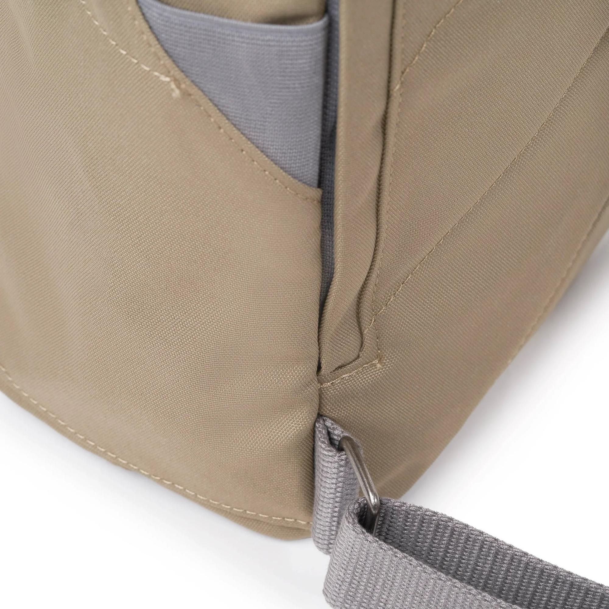 Roka Finchley taupe recycled canvas tote bag with grey strap and side pocket, sustainable and stylish accessory.