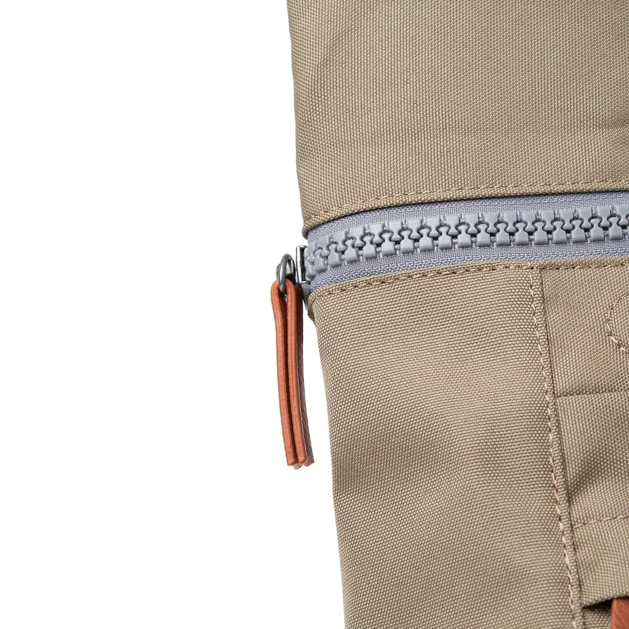 Roka Finchley tote bag in taupe recycled canvas with silver zipper and leather pull tab detail.