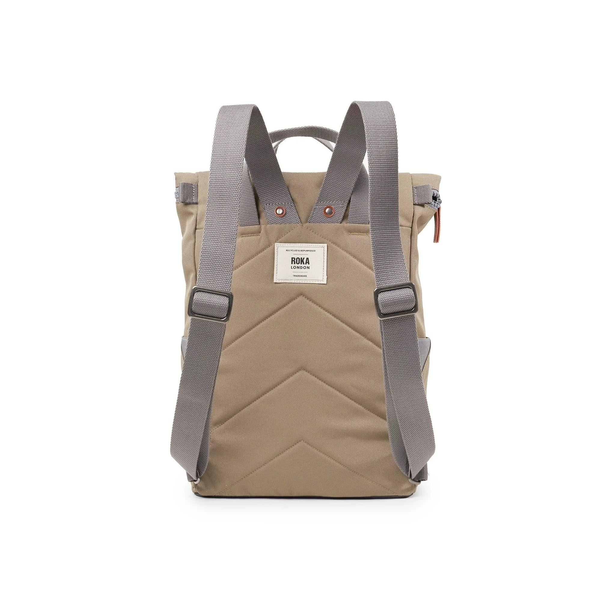 Roka Finchley A Taupe Recycled Canvas backpack with gray straps, front zip pocket, and reinforced base, eco-friendly travel bag.