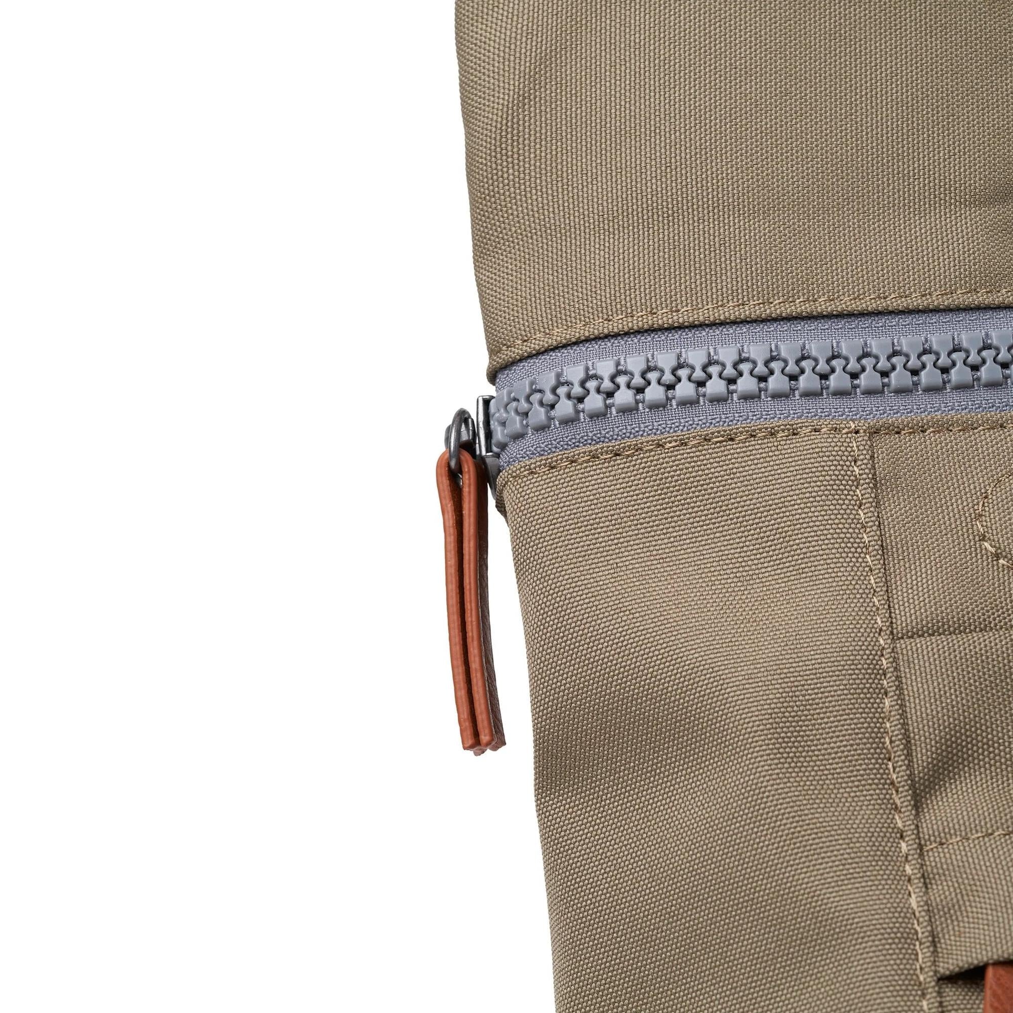Roka Finchley tote bag in taupe recycled canvas with gray zipper and leather pull tab, eco-friendly and durable design.