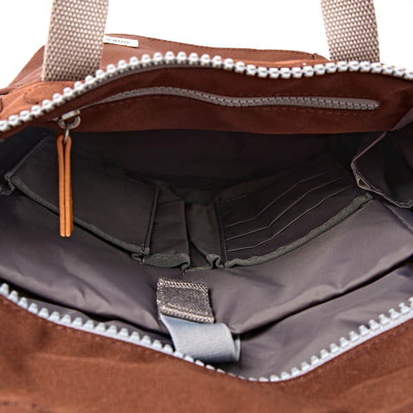 Roka Finchley Small Chocolate Recycled Canvas Backpack, side view.