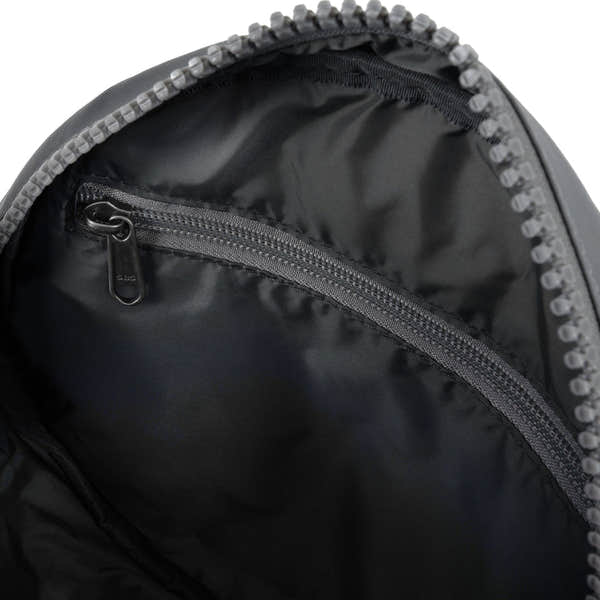 Roka Paddington B Stormy Small Recycled Nylon backpack interior with zippered pocket, black interior lining.