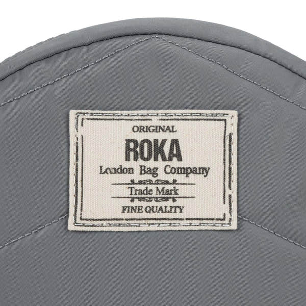 Roka Paddington B Stormy small recycled nylon backpack with logo patch, gray color, compact design, waterproof material.
