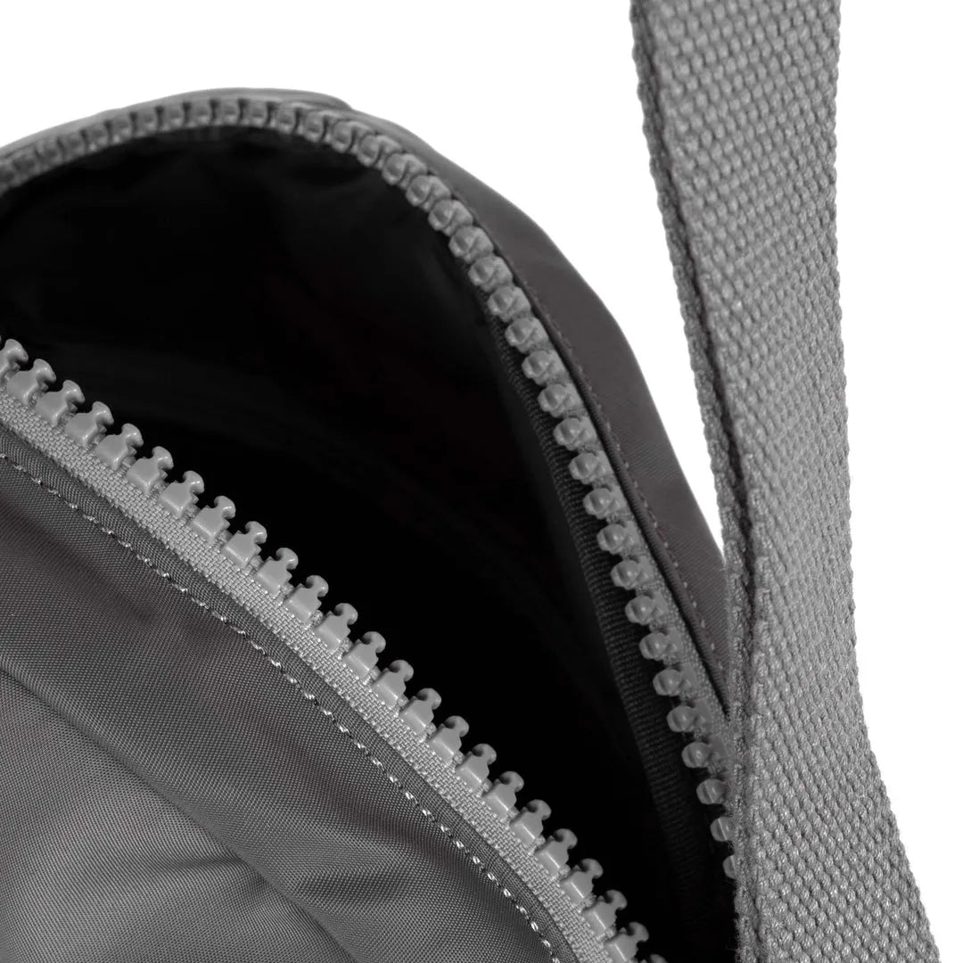 Roka Paddington B Graphite small recycled nylon backpack with zipper closure and padded straps.