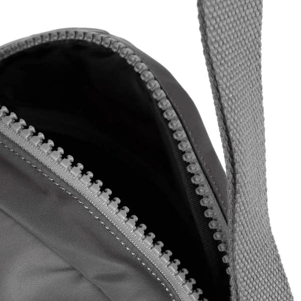 Roka Paddington B Graphite small recycled nylon backpack with zipper closure and padded straps.
