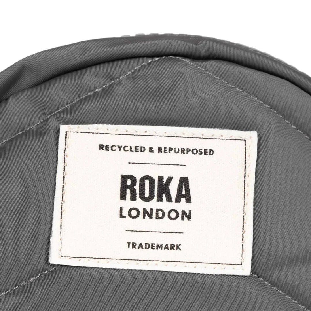 Roka Paddington B Graphite small recycled nylon backpack with logo label, durable and eco-friendly material.