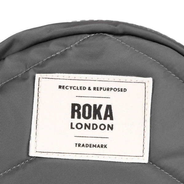 Roka Paddington B Graphite small recycled nylon backpack with logo label, durable and eco-friendly material.