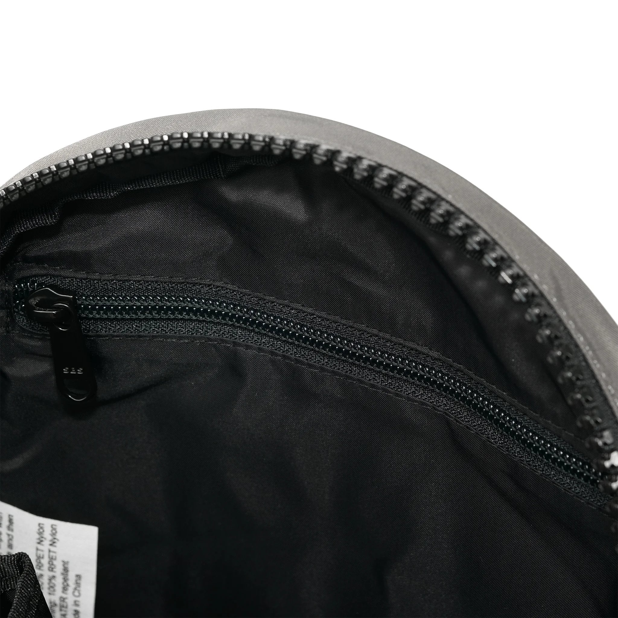 Roka Paddington Graphite Recycled Nylon Crossbody Bag, side view.