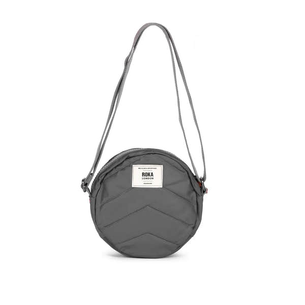 Roka Paddington B Graphite small recycled nylon crossbody bag with chevron pattern and adjustable strap.