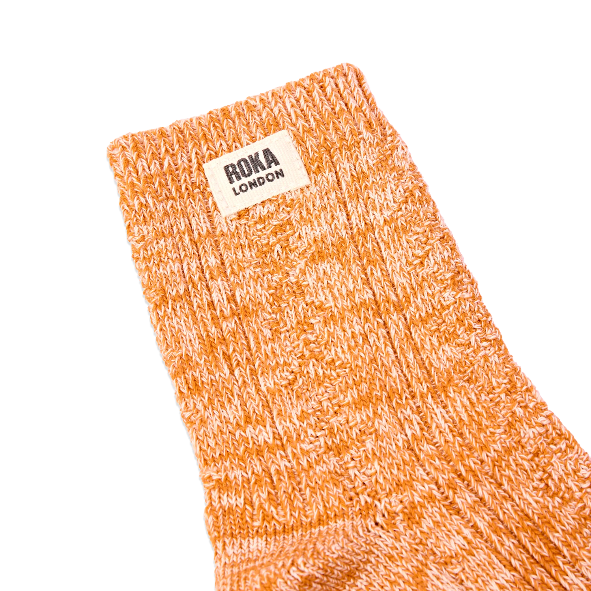Roka Wallace Crew Socks for Women in Burnt Orange — ribbed cuff and logo close-up.