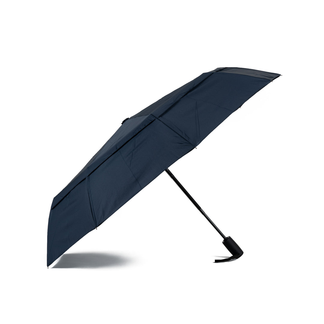 Roka Waterloo Midnight Recycled Nylon umbrella, navy blue compact design with black handle, waterproof, eco-friendly rain protection.