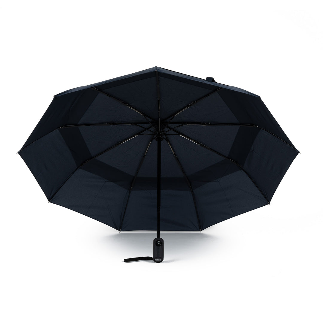 Roka Waterloo Midnight Recycled Nylon umbrella, foldable black design with sturdy handle, eco-friendly and wind-resistant.