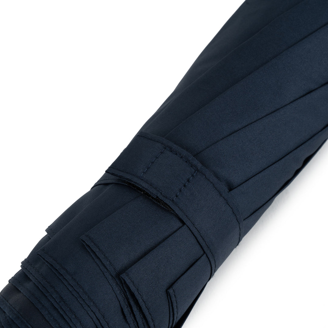 Roka Waterloo Midnight Recycled Nylon bag with sleek navy blue design, multiple compartments, and adjustable strap.