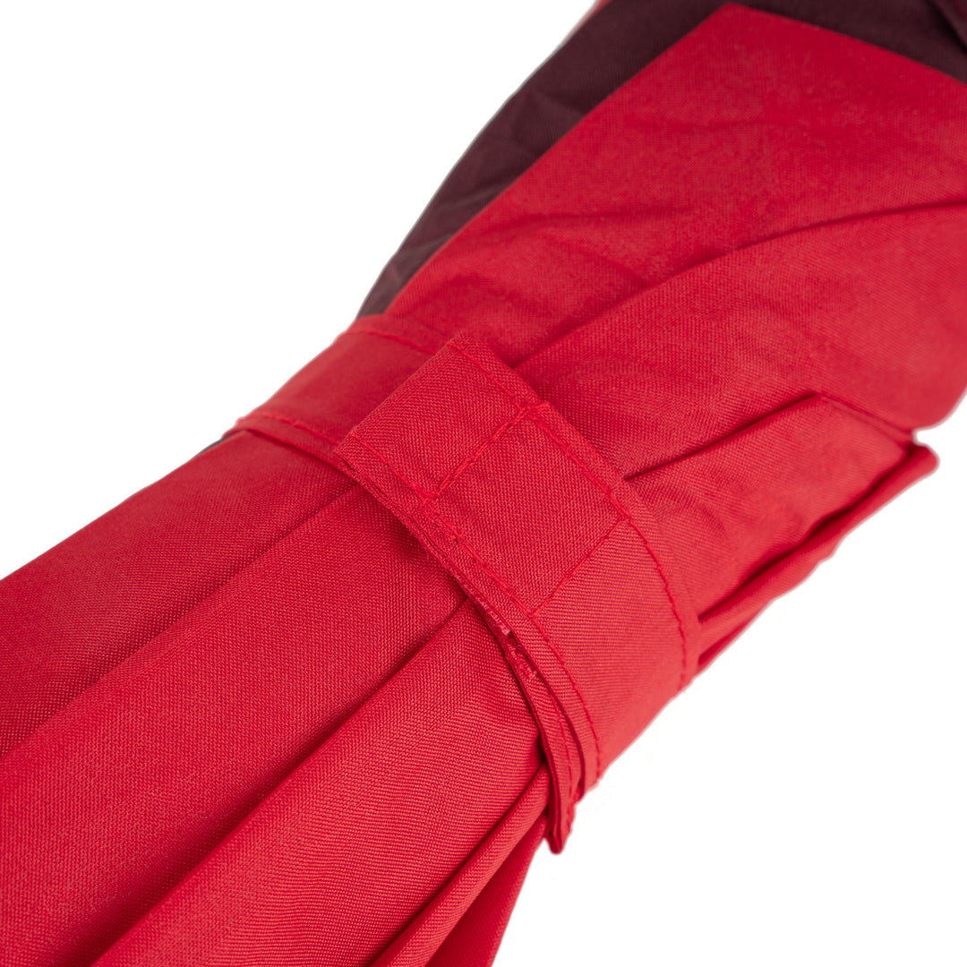 Roka Waterloo recycled polyester umbrella in cranberry and plum colors, featuring a compact fold and sturdy strap.