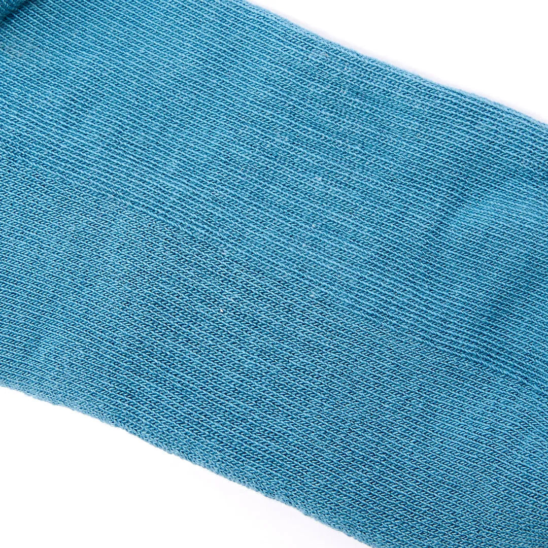 Blue Roka Wembley Cotton Socks in Adriatic color theme, close-up of textured knit fabric.