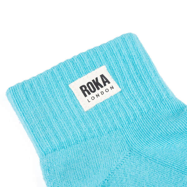 Roka Wembley Cotton Socks in Aquatic Awe blue with white logo, breathable, comfortable athletic sock for casual or sports wear.