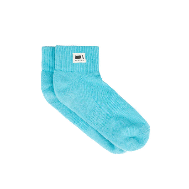 Roka Wembley Cotton Socks in Aquatic Awe blue, ankle-length with ribbed cuff and logo label, ideal for casual wear.