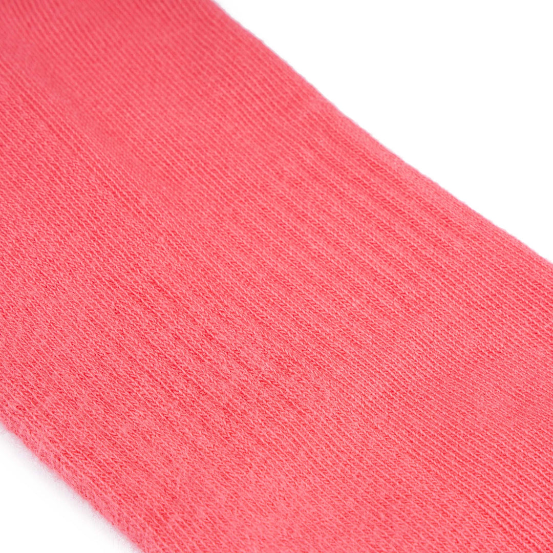 Roka Wembley coral cotton socks, close-up of soft, breathable fabric, vibrant coral color, lightweight everyday wear.