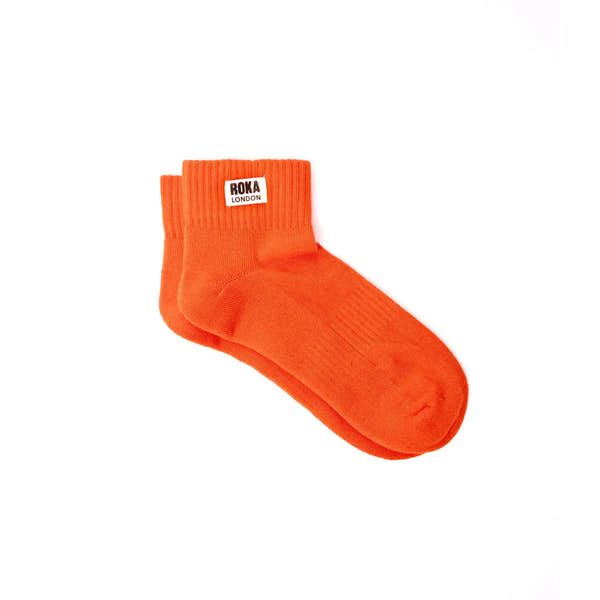 Roka Wembley Cotton Socks in Jaffa Orange color, knee-high design, soft cotton material, stylish and comfortable for everyday wear.